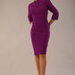 Model wearing the Diva Daphne ¾ Sleeved dress with pleat detail across the hips and ¾ sleeve length in purple magic front image