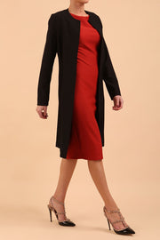 model wearing diva catwalk teal coat with long sleeves and a belt in Black front side