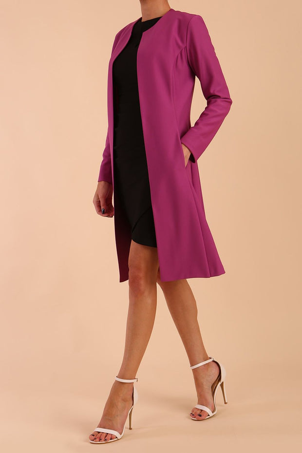 model wearing diva catwalk teal coat with long sleeves and a belt in Orchid Purple side