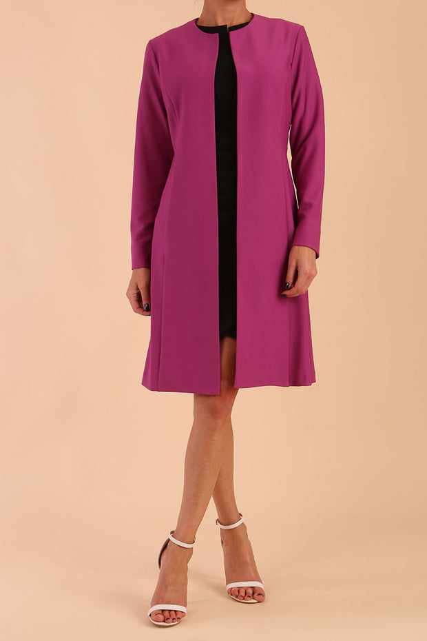 model wearing diva catwalk teal coat with long sleeves and a belt in Orchid Purple front