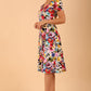 Model wearing a diva catwalk Iris Print Dress short sleeve swing skirt in Fusion Print Colour