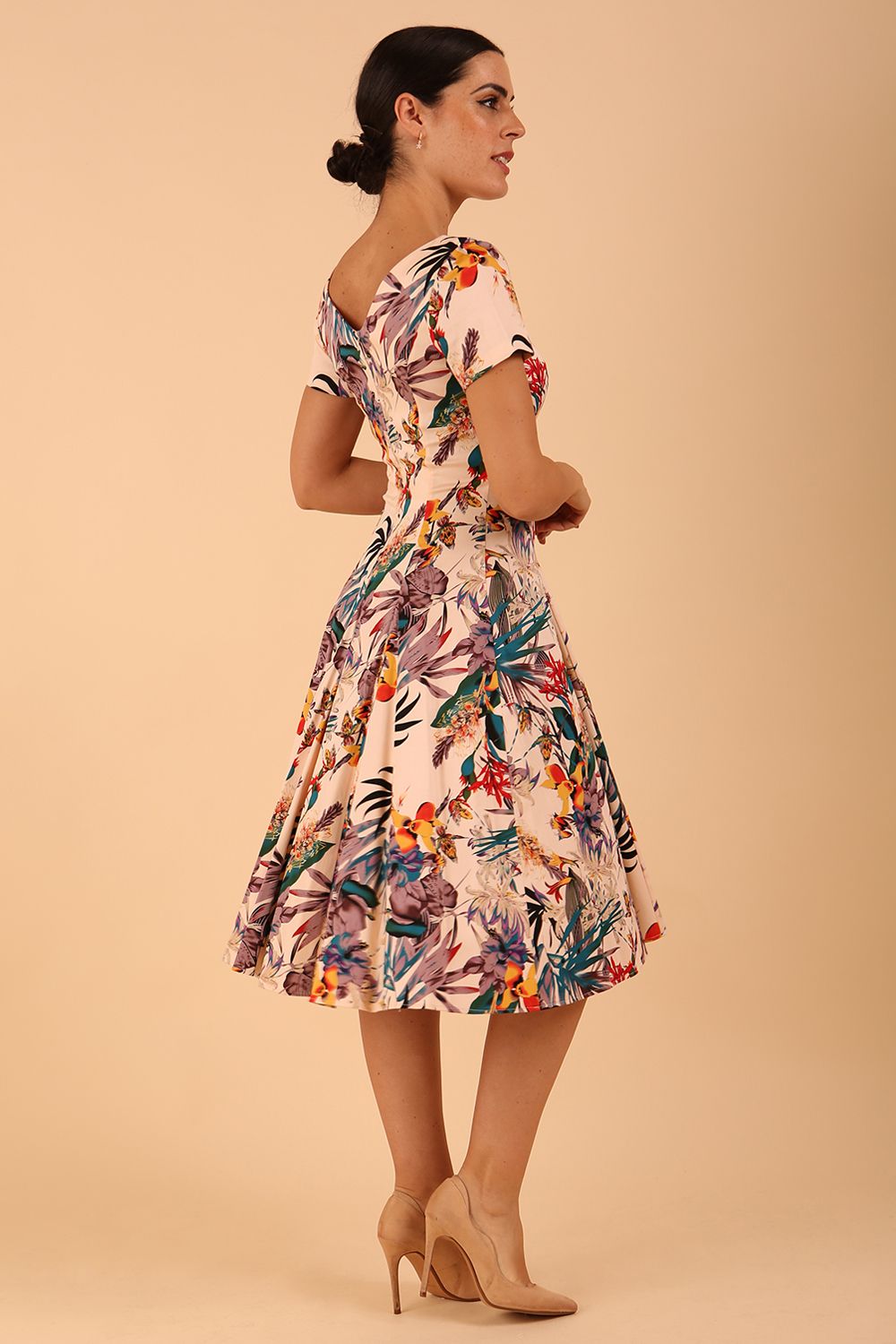 Model wearing a diva catwalk Iris Print Dress short sleeve swing skirt in Rainforest print back