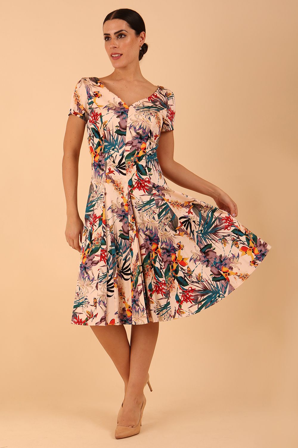Model wearing a diva catwalk Iris Print Dress short sleeve swing skirt in Rainforest print front