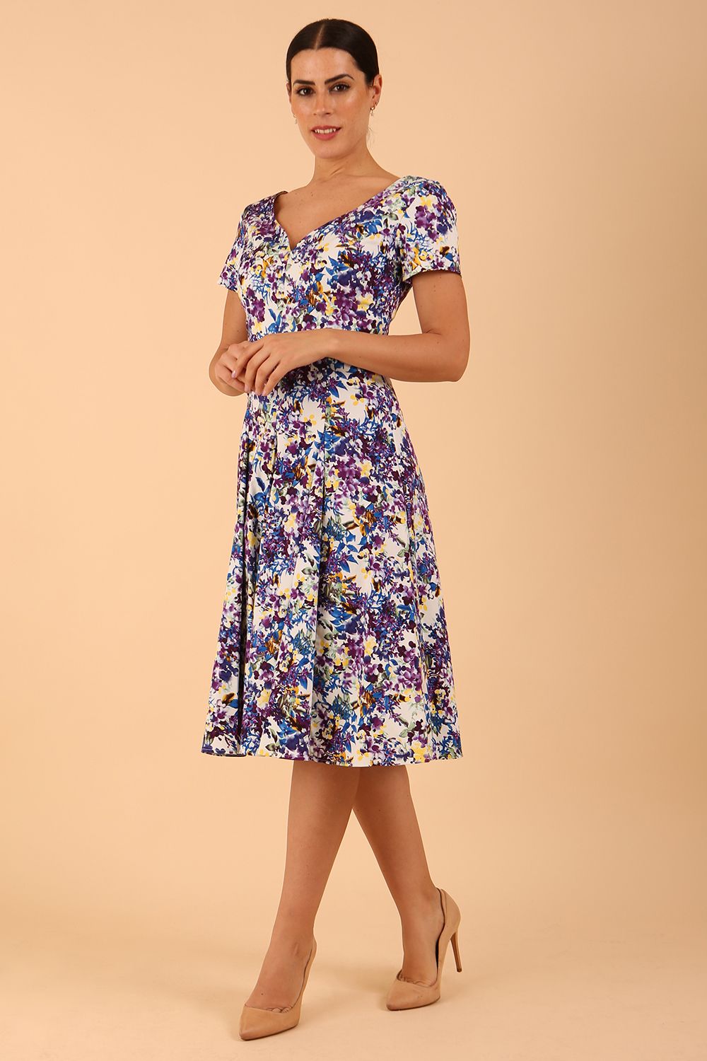 Model wearing a diva catwalk Iris Print Dress short sleeve swing skirt in Kew print front