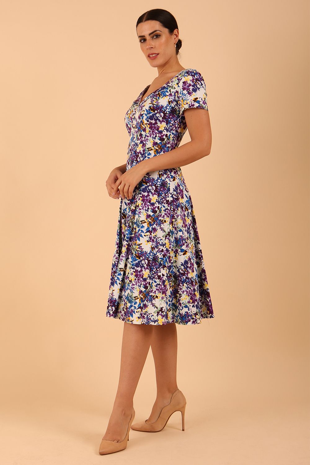 Model wearing a diva catwalk Iris Print Dress short sleeve swing skirt in Kew print side