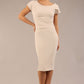 brunette model wearing a diva catwalk Seed Leela Rounded Neckline Cap Sleeved Pencil dress Dress in sandy cream colour front 