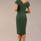 brunette model wearing a diva catwalk Seed Leela Rounded Neckline Cap Sleeved Pencil dress Dress in chrome green colour back