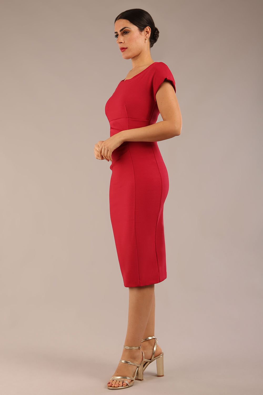 brunette model wearing a diva catwalk Seed Leela Rounded Neckline Cap Sleeved Pencil dress Dress in crimson pink colour front side