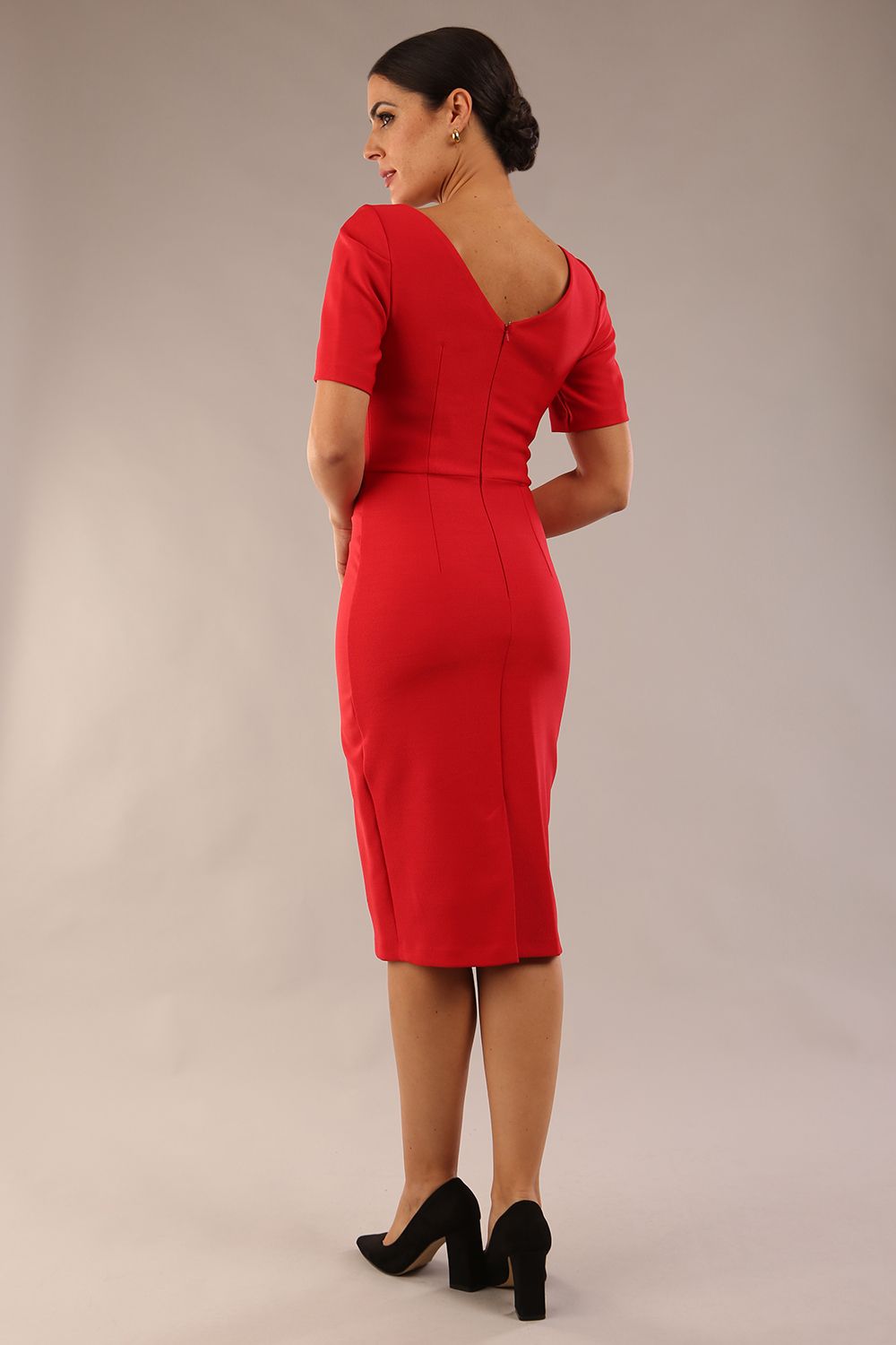 model is wearing diva catwalk seed charlotte pencil plain dress with short sleeve and pleated detail on the shoulder in salsa red colour back