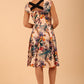 model wearing a diva catwalk Shayla Swing Dress sleeveless swing skirt dress in rainforest print colour back