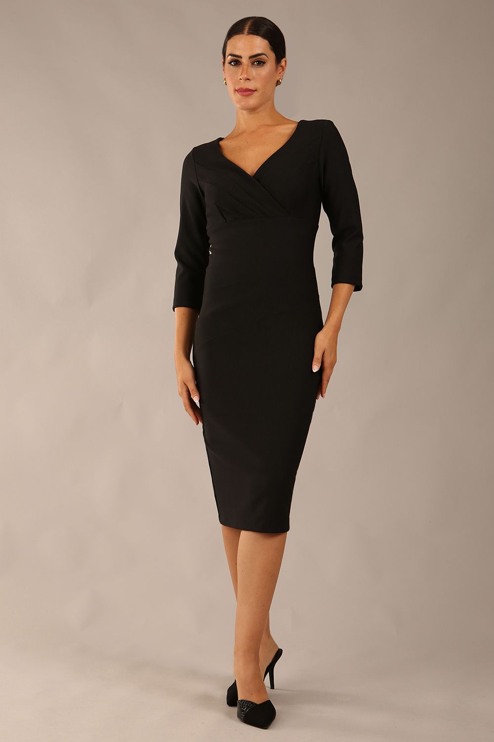 model wearing a diva catwalk Seed Barton Sleeved Pencil Dress 3/4 sleeves and v neckline and knee length with pleating details in black colour