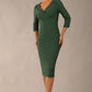 model wearing a diva catwalk Seed Barton Sleeved Pencil Dress 3/4 sleeves and v neckline and knee length with pleating details in chrome green colour