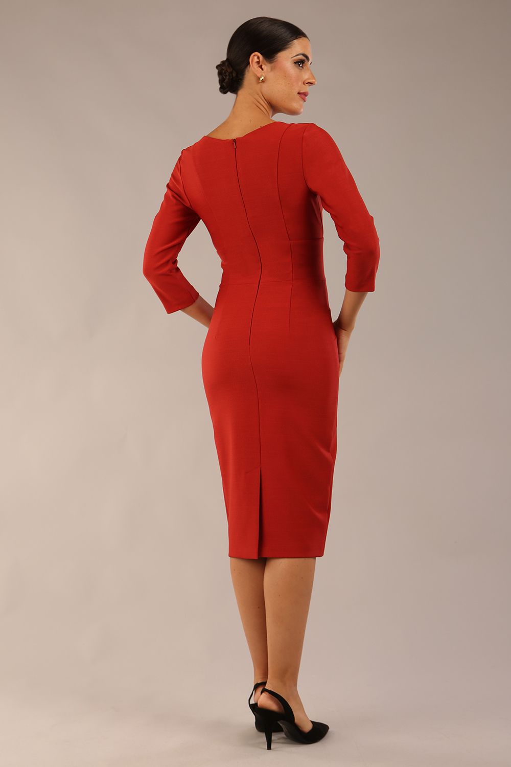 model wearing a diva catwalk Seed Barton Sleeved Pencil Dress 3/4 sleeves and v neckline and knee length with pleating details in garnet red colour