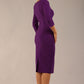 model wearing a diva catwalk Seed Barton Sleeved Pencil Dress 3/4 sleeves and v neckline and knee length with pleating details in imperial purple colour