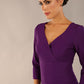 model wearing a diva catwalk Seed Barton Sleeved Pencil Dress 3/4 sleeves and v neckline and knee length with pleating details in imperial purple colour