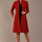 blonde model wearing diva catwalk couture fine raquella coat with buttons across the front and long sleeves with high neck and pockets in garnet red colour front (Garnet Red)