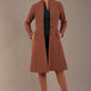 model wearing diva catwalk couture fine raquella coat with buttons across the front and long sleeves with high neck and pockets in acorn brown colour front (Acorn Brown)