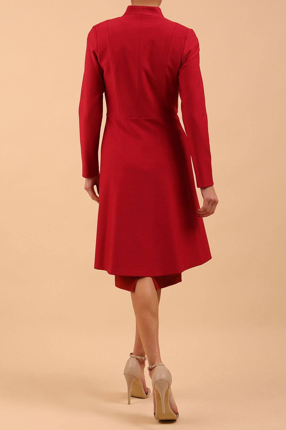 brunette model wearing diva catwalk couture fine raquella coat with buttons across the front and long sleeves with high neck and pockets in crimson pink colour back
