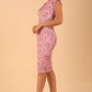 Model wearing a diva catwalk Vera Floral Dress sleeveless in jacquard  fabric pencil dress in pink lavender colour front side