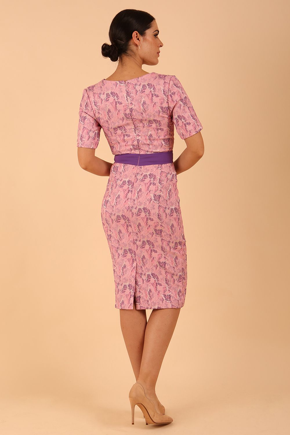 model wearing a diva catwalk Floella Jacquard Dress shor sleeves pencil dress in jacquard fabric in pink lavender with purple waistband contrast colour back