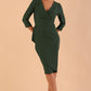 Model wearing DIVA Seed Rosemary Low V-Neckline Sleeved Pencil Dress in chrome green colour