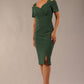 brunette model wearing diva catwalk amorette pencil skirt dress with a cold shoulder detaul and pleating across the bust and slit on a side of skirt in hunter green front