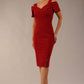 brunette model wearing diva catwalk amorette pencil skirt dress with a cold shoulder detaul and pleating across the bust and slit on a side of skirt in rosewood red colour front