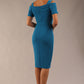 brunette model wearing diva catwalk amorette pencil skirt dress with a cold shoulder detaul and pleating across the bust and slit on a side of skirt in tropic teal back