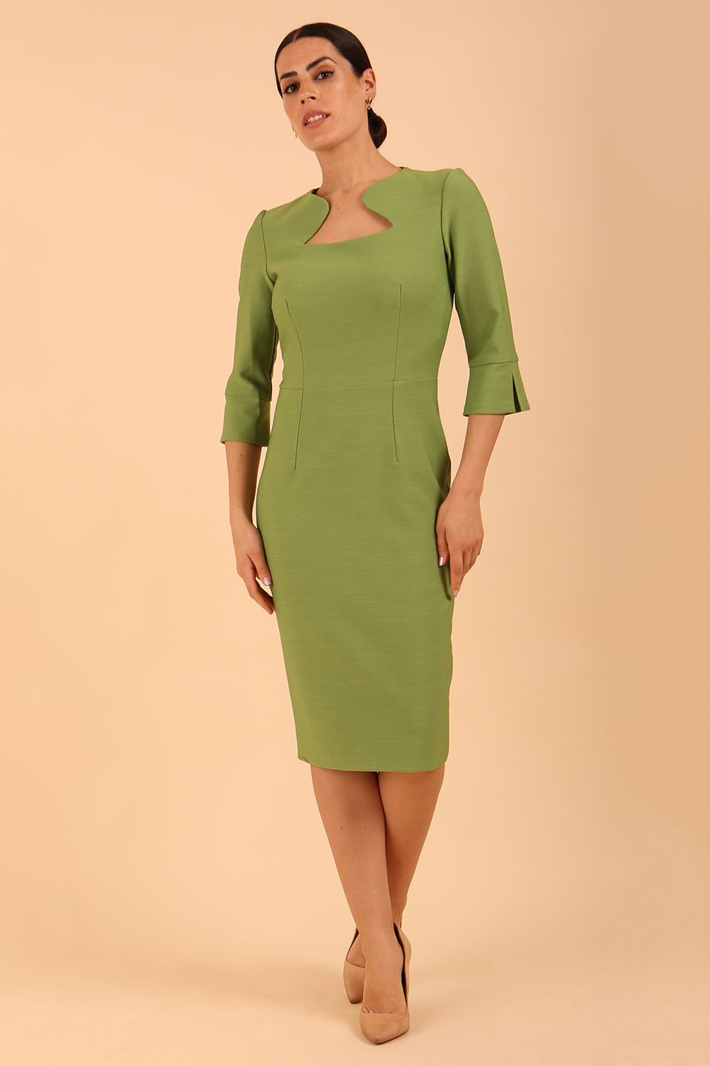 Brunette model is wearing couture stretch seed pencil bell 3/4 sleeve pencil dress by diva catwalk in Citrus Green front image