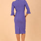 Brunette model is wearing couture stretch seed pencil bell 3/4 sleeve pencil dress by diva catwalk in Dawn Indigo back image