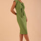 Model wearing Seed Lucca Tie Detail Sleeveless Pencil Dress in citrus green colour