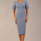 model is wearing diva catwalk seed barton short sleeve pencil dress with v-neck in steel blue front 