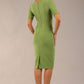 model is wearing diva catwalk seed barton short sleeve pencil dress with v-neck in citrus green back