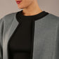 Model wearing the Diva Alverstone Coat in Citadel Blue and black back image  with pockets
