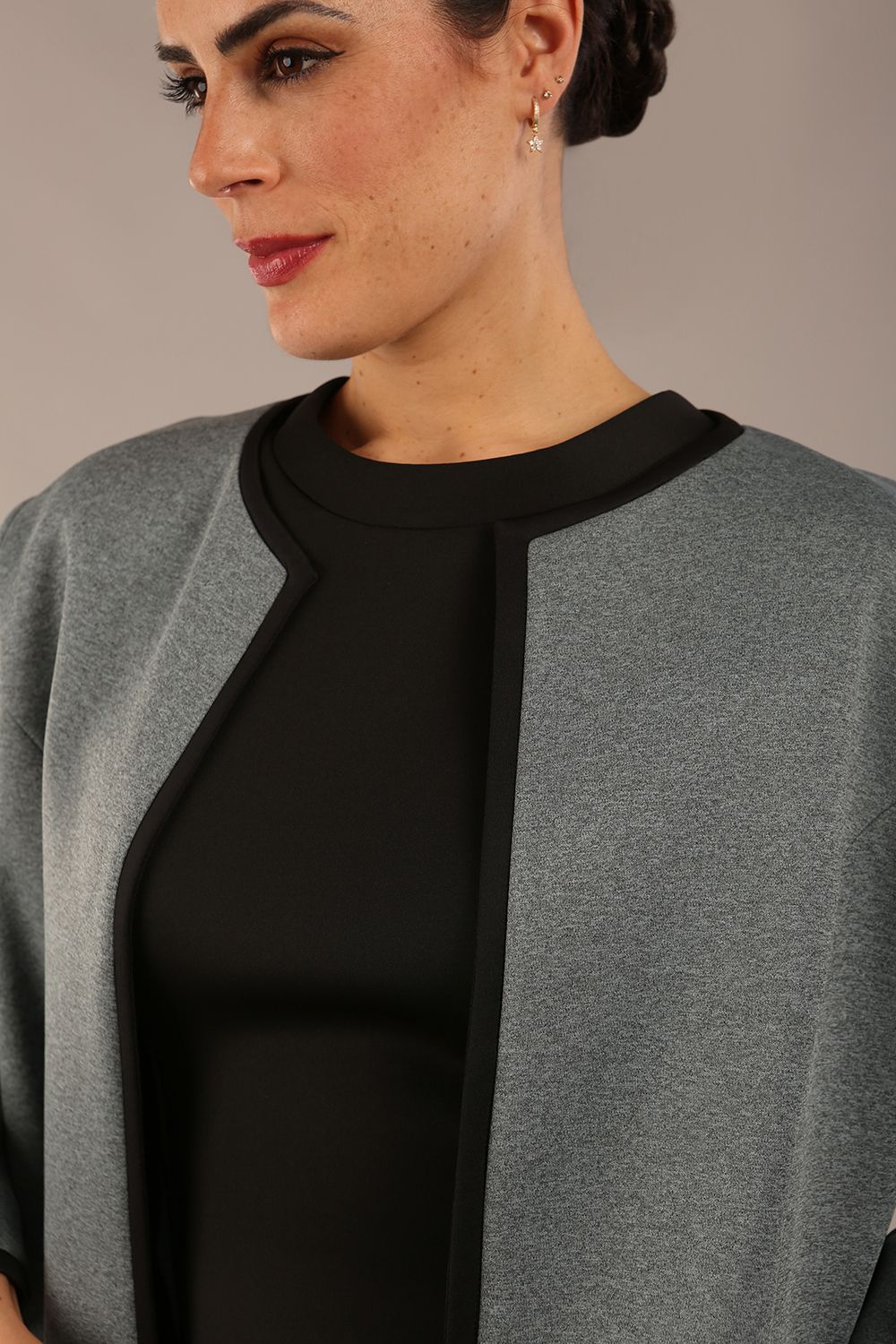 Model wearing the Diva Alverstone Coat in Citadel Blue and black back image  with pockets