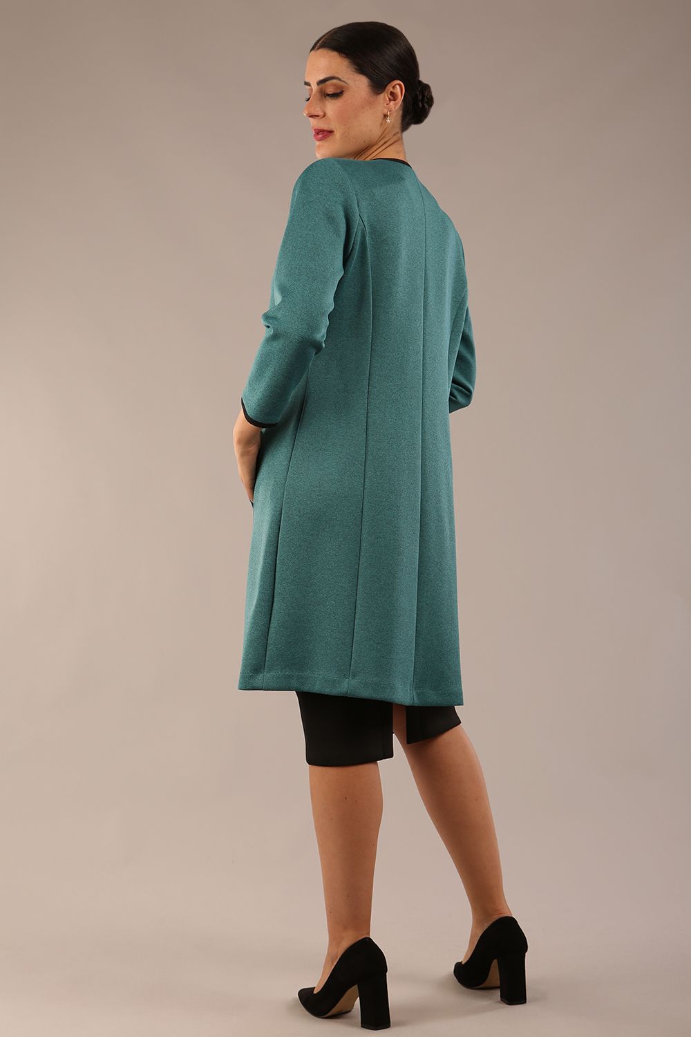 Model wearing the Diva Alverstone Coat in Melange Teal and black back image  with pockets