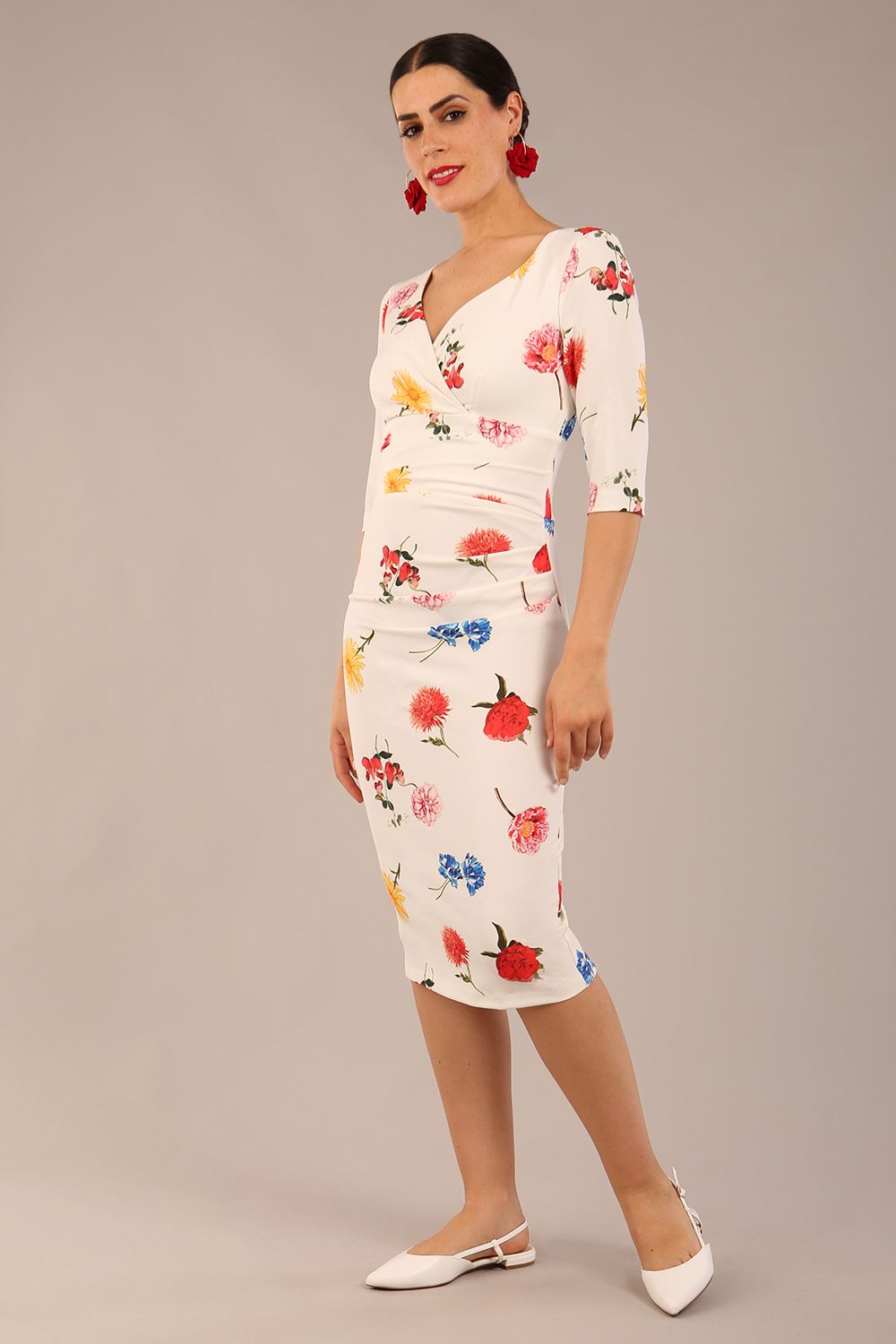 brunette model is wearing a diva catwalk Cynthia Floral Print Dress sleeved crossover v neckline knee length in Buttercup Print front image