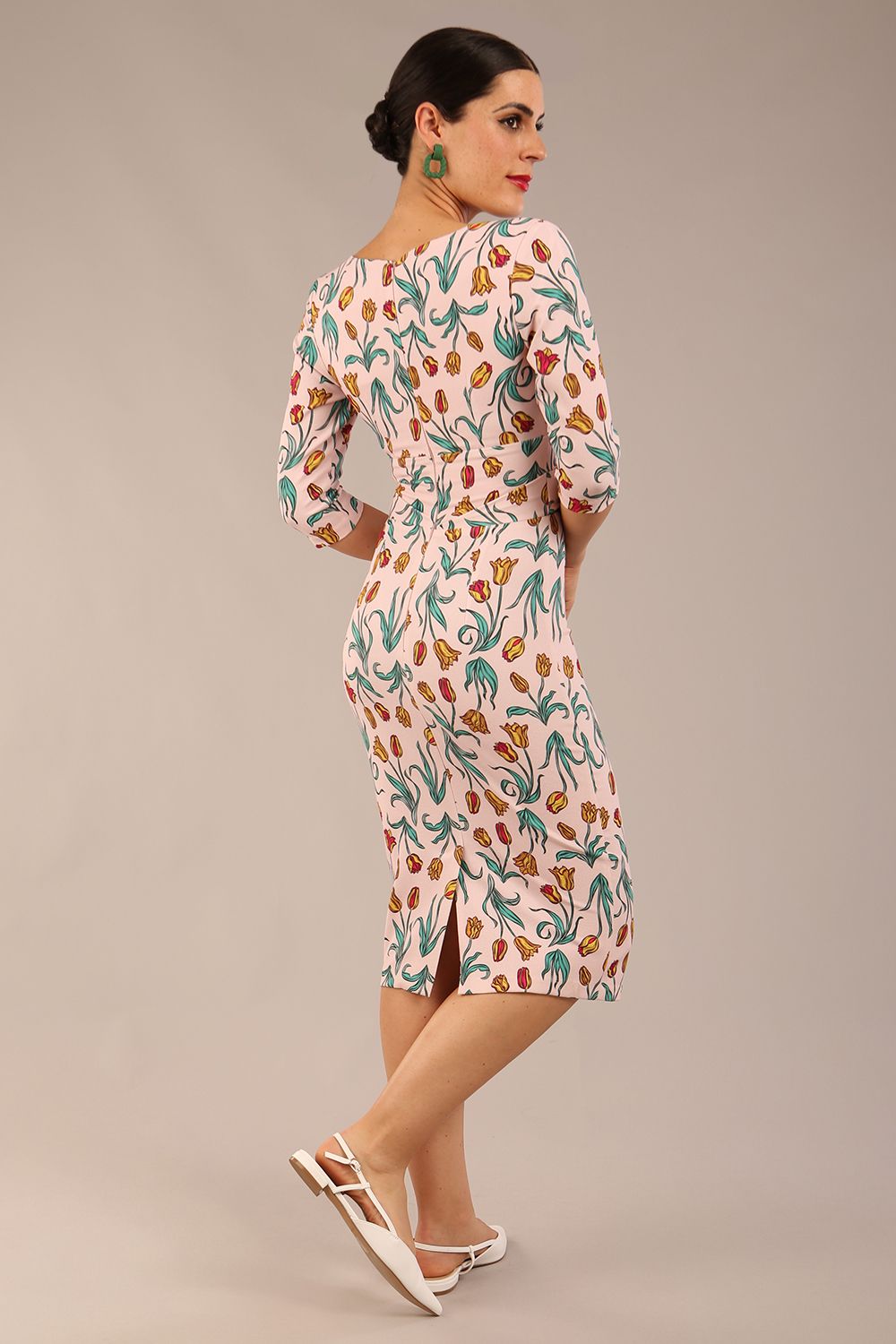 brunette model is wearing a diva catwalk Cynthia Floral Print Dress sleeved crossover v neckline knee length in Linear Tulip back image