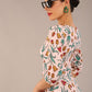 brunette model is wearing a diva catwalk Cynthia Floral Print Dress sleeved crossover v neckline knee length in Linear Tulip Print back image