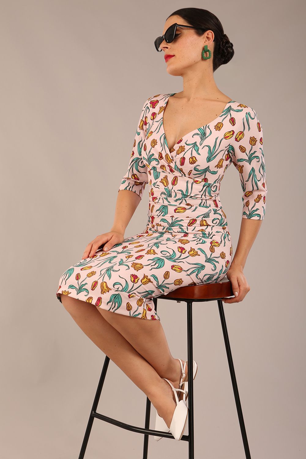 brunette model is wearing a diva catwalk Cynthia Floral Print Dress sleeved crossover v neckline knee length in Linear Tulip Print front image