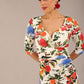 brunette model is wearing a diva catwalk Cynthia Floral Print Dress sleeved crossover v neckline knee length in Eden Print front image