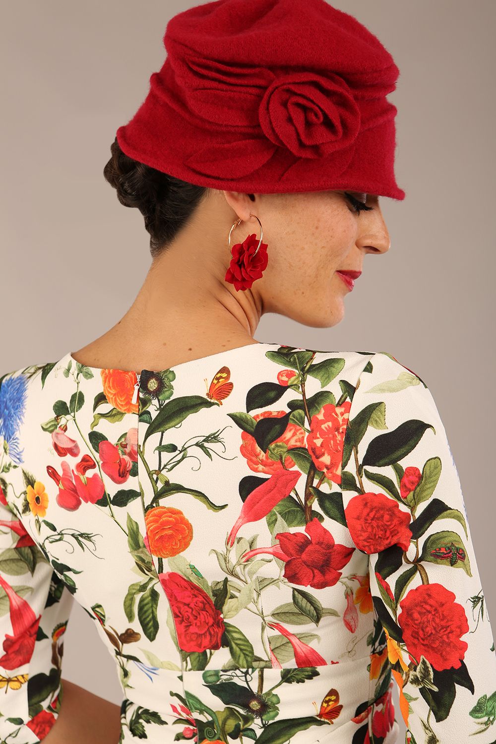 brunette model is wearing a diva catwalk Cynthia Floral Print Dress sleeved crossover v neckline knee length in Eden Print back image