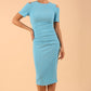 Model wearing the Diva Atlas Pencil dress with round neckline short sleeved dress with small cutouts on the shoulders in crystal blue front