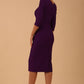 Model wearing diva catwalk Seed Divine Dress 3/4 sleeved knee length in imperial purple colour