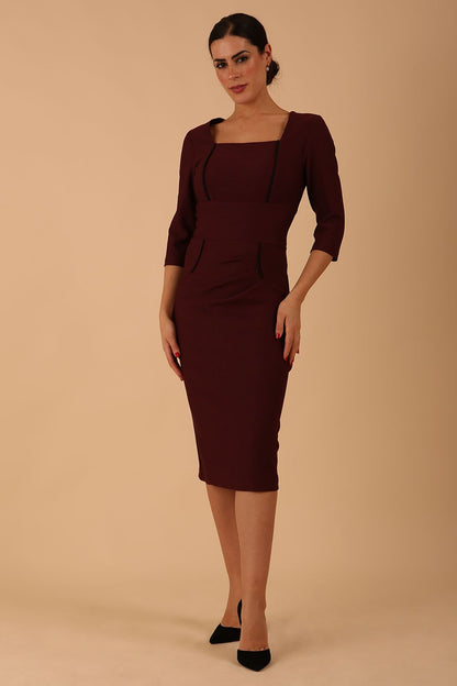 Model wearing diva catwalk Seed Divine Dress 3/4 sleeved knee length in port royale colour