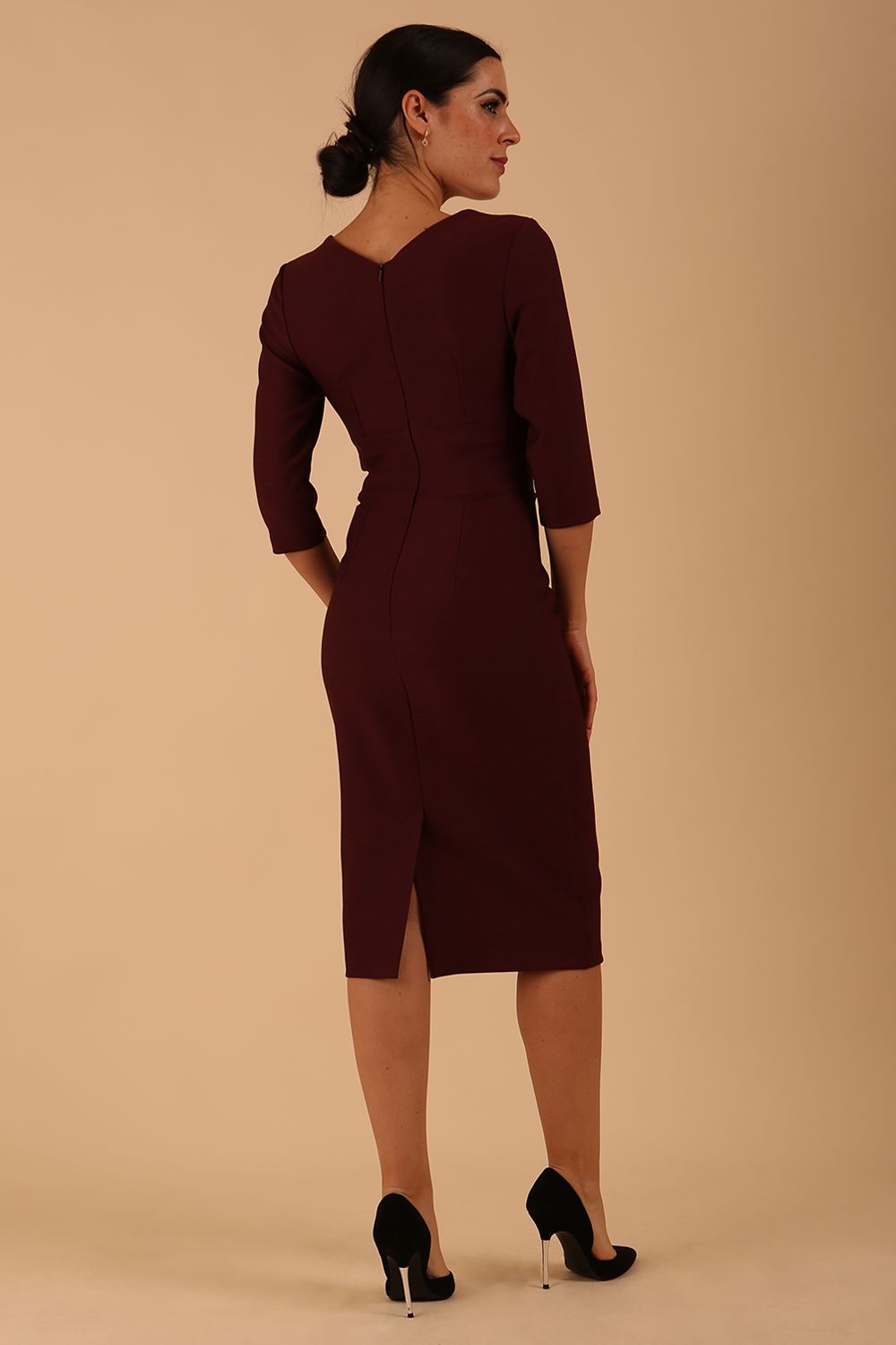 Model wearing diva catwalk Seed Divine Dress 3/4 sleeved knee length in port royale colour