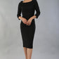 model wearing a divacatwalk Seed Spotlight Round Collar Dress 3/4 sleeve knee length in black colour