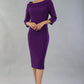 model wearing a divacatwalk Seed Spotlight Round Collar Dress 3/4 sleeve knee length in imperial purple colour