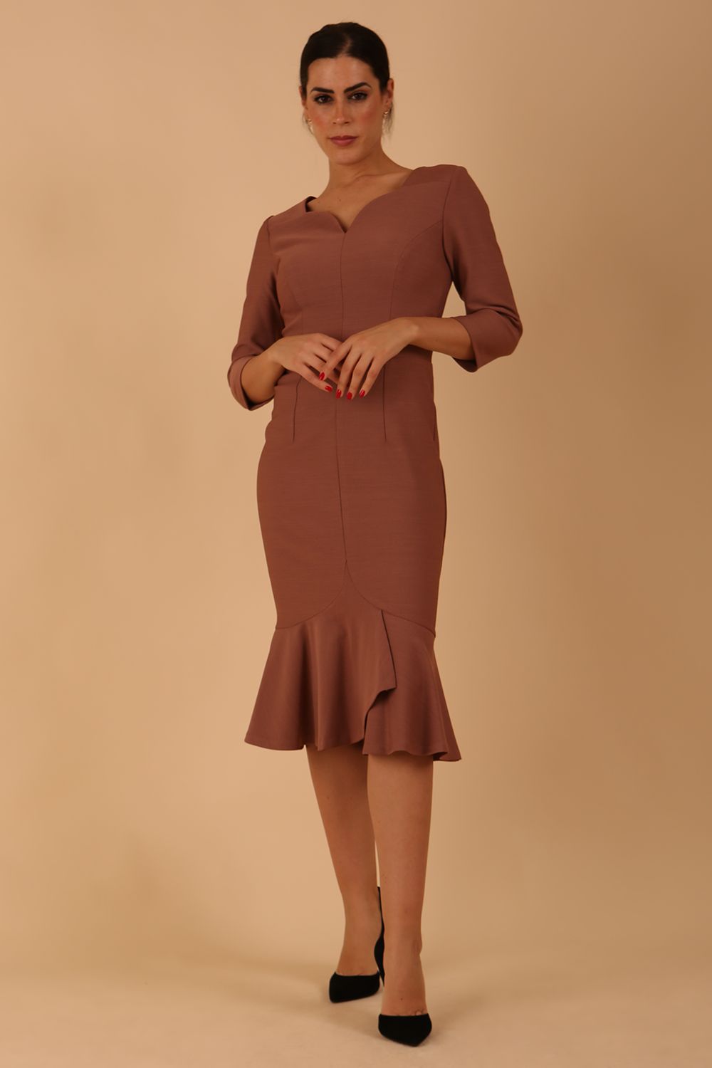 model wearing a diva catwalk Seed Brecon Fishtail Sleeved Dress in acorn brown colour