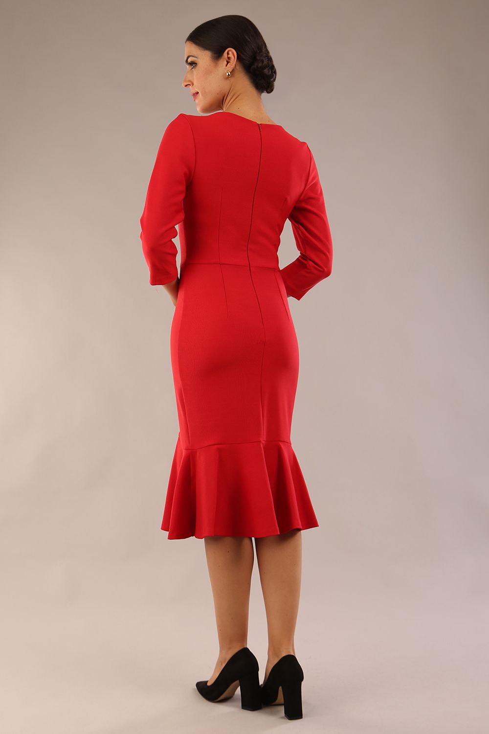 model wearing a diva catwalk Seed Brecon Fishtail Sleeved Dress in salsa red colour back